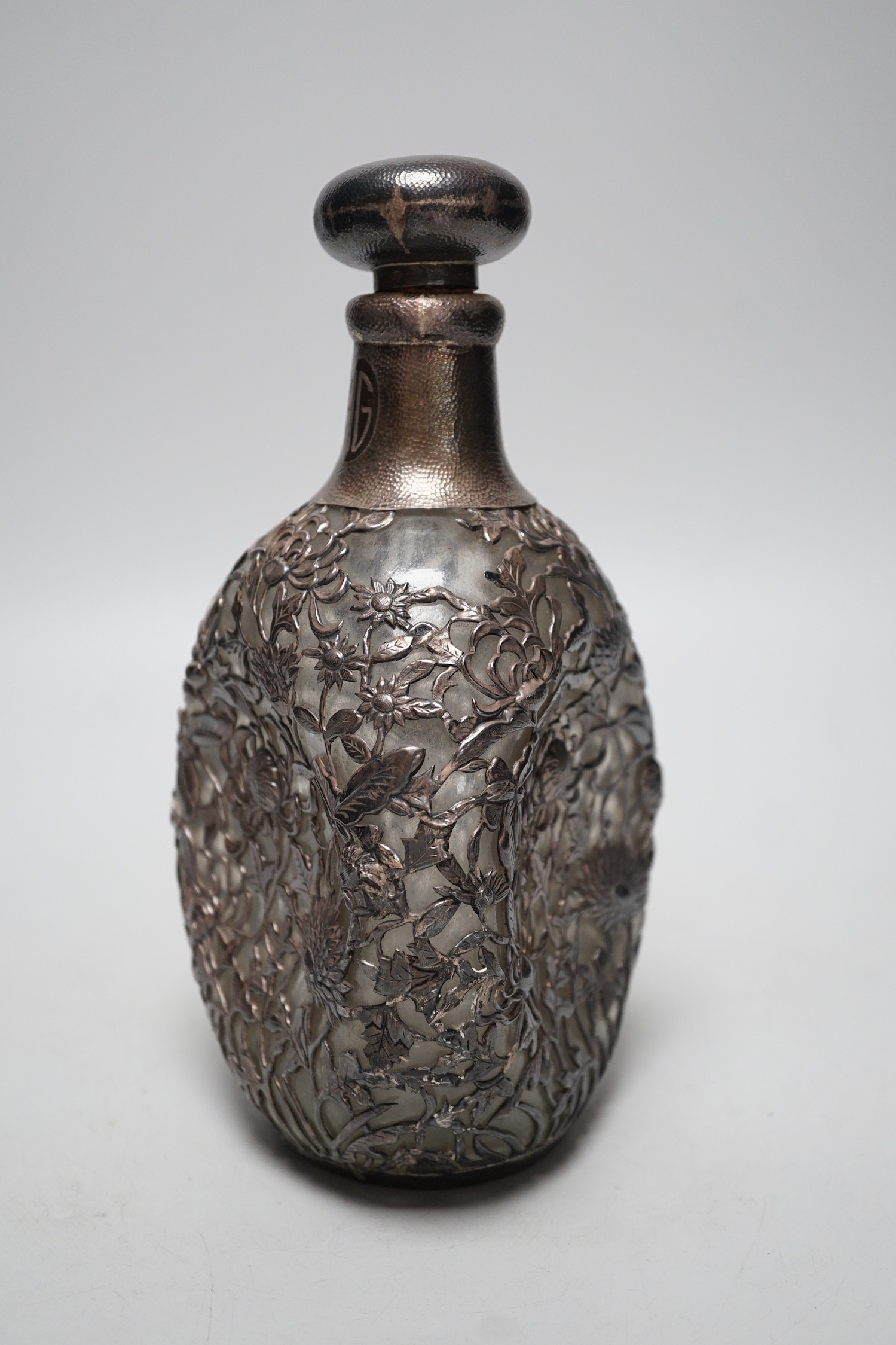 A Chinese planished white metal mounted dimpled decanter and stopper, by Yeching, 23.5cm.